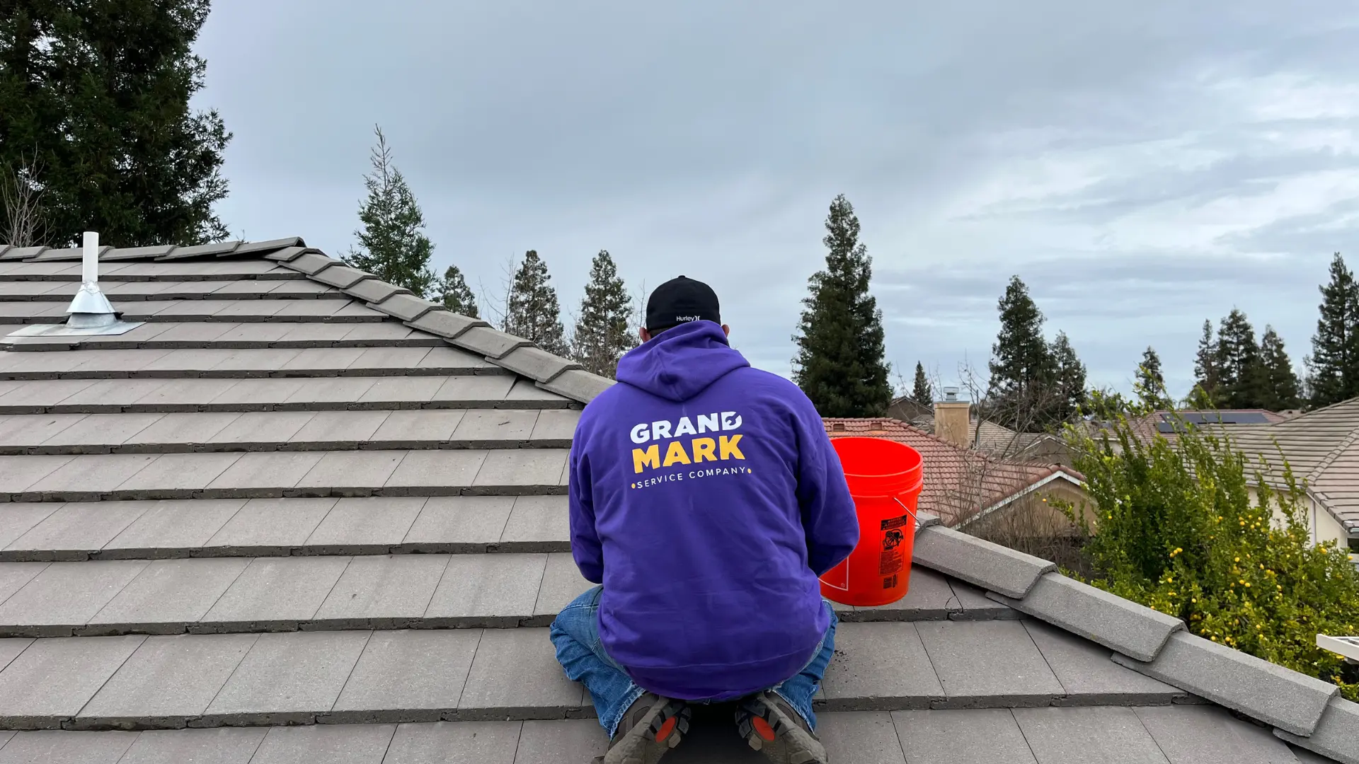 Grandmark roofer performing a roof repair, Central California