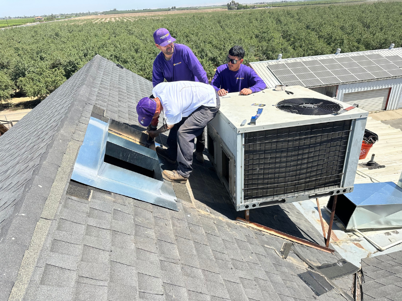 Grandmark HVAC technician replacing an AC system